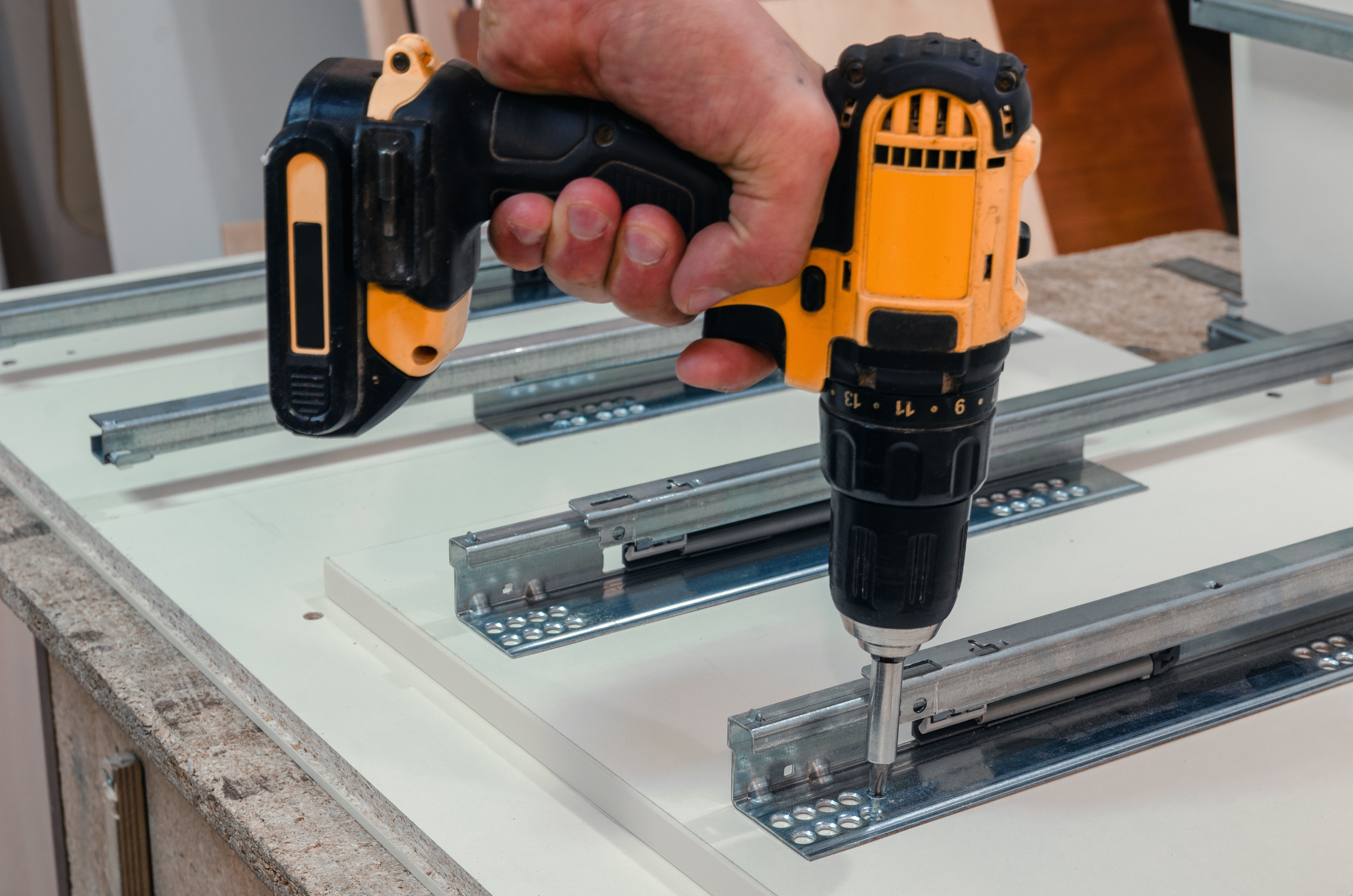 Craftsman assembling wooden furniture